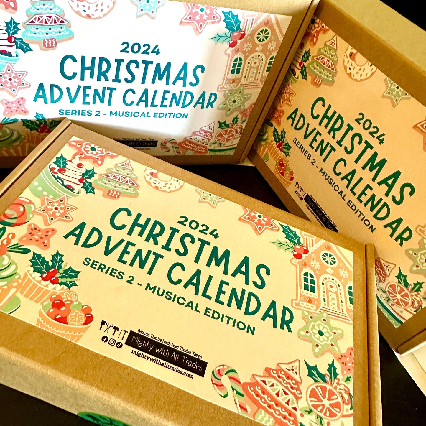 Three 2024 Christmas Advent Calendar boxes with festive designs on a dark background.