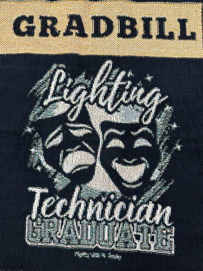 woven blanket with 'Gradbill' text and theatre design on a black background