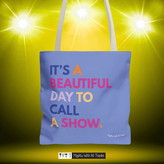 Purple tote bag with it's a beautiful day to call a show colorful text on a yellow background