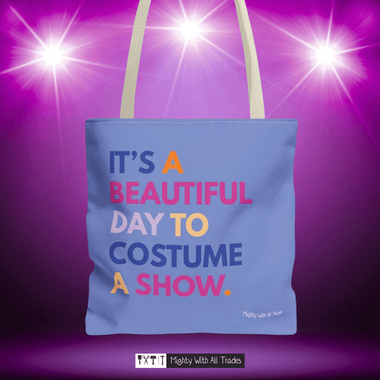 purple tote bag with it'a beautiful day to costume a show colorful text on a purple background