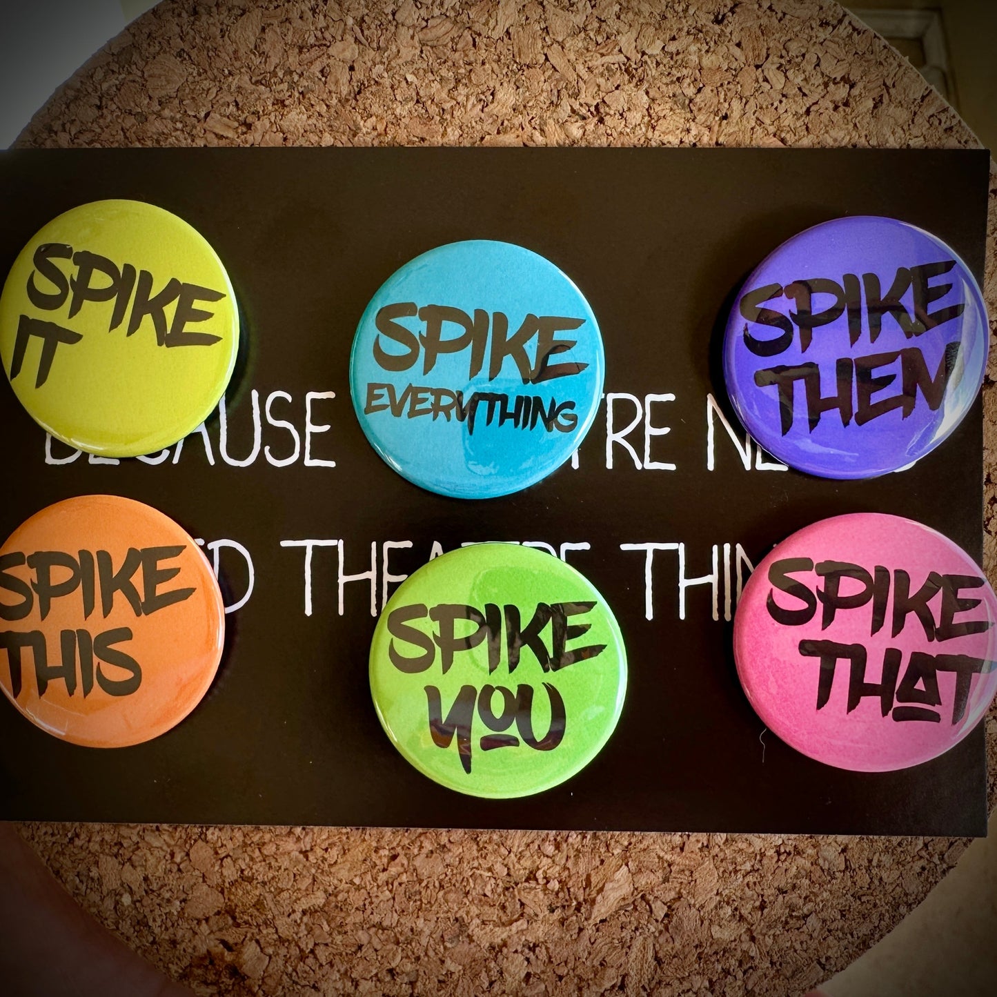 Set of colorful buttons with text on a cork background