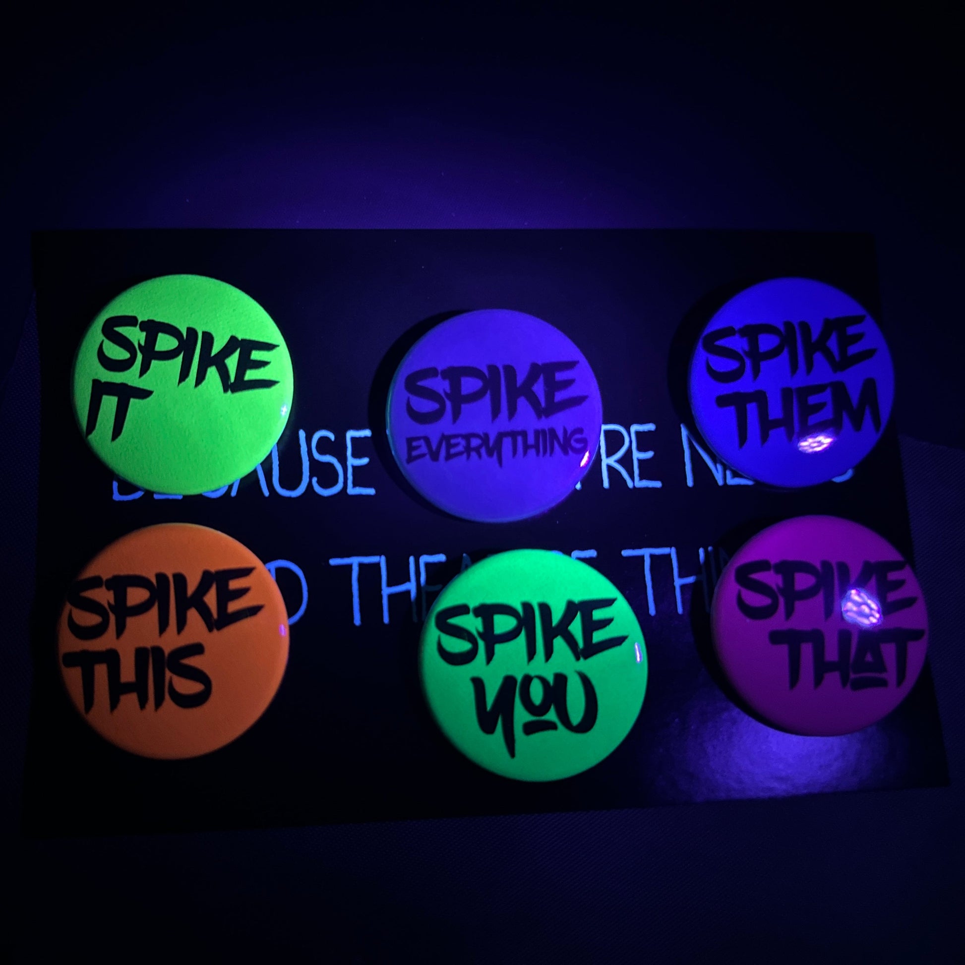 Set of six glowing buttons with text on a black background