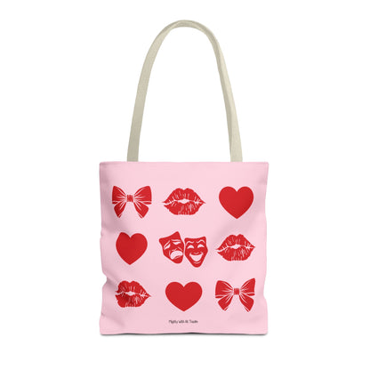 Pink tote bag with red theatre graphics on a white background