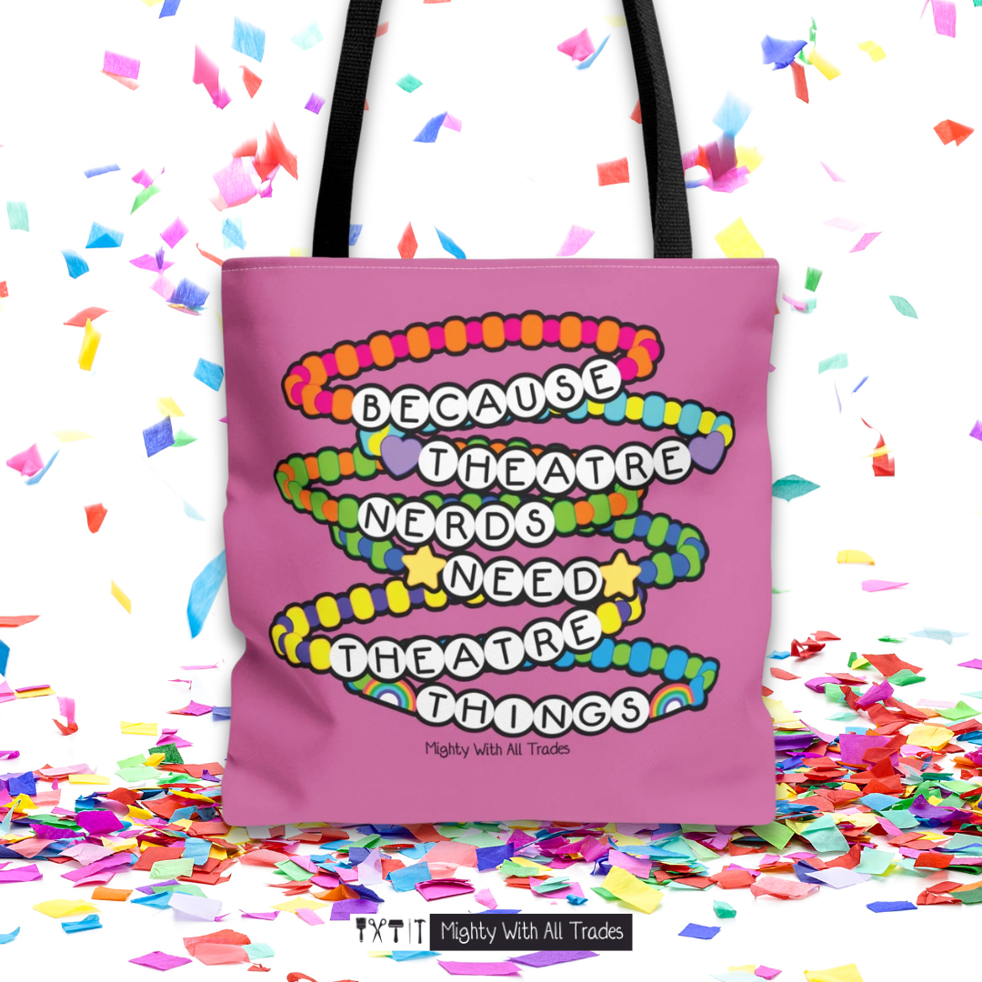 Pink tote bag with colorful beaded bracelet design 'Because theatre nerds need theatre things" on a confetti background