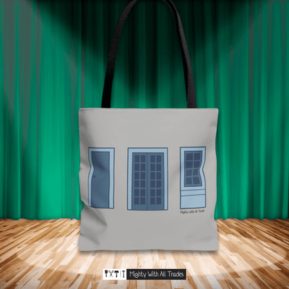 Tote bag with oil one act play window design on a wooden floor with green curtain background