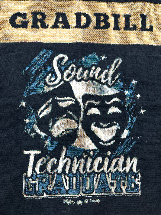 woven blanket with 'Gradbill' text and theatre design on a black background