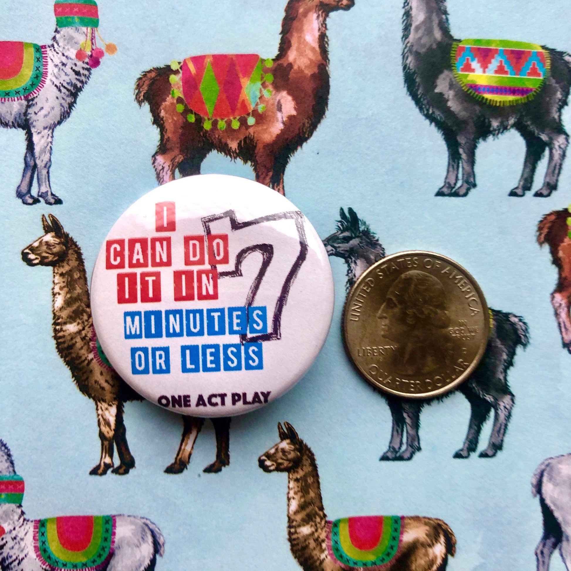 white button with red white and blue graphic on a llama background with coin for size reference
