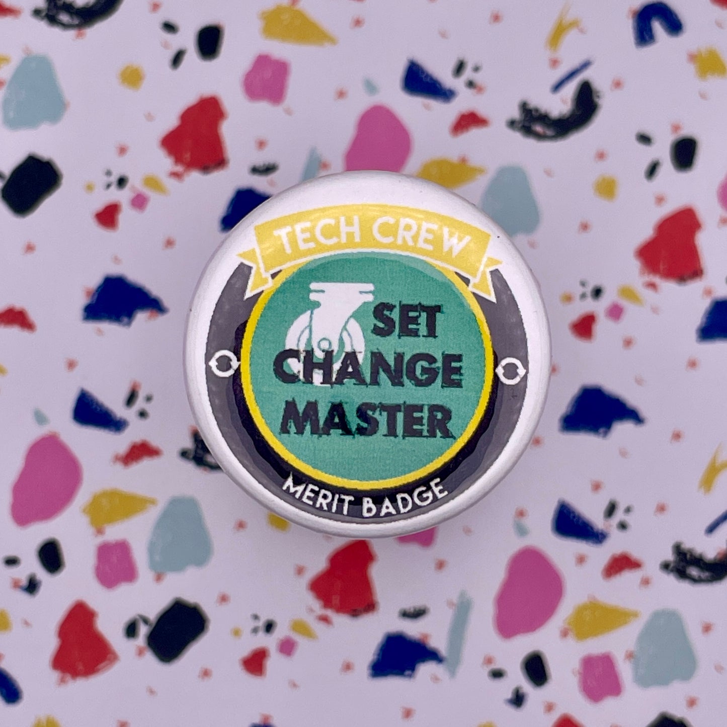 green caster on round button on colorful background