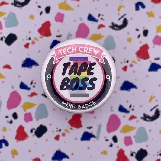 stack of spike tape graphic on white pink button on a colorful background