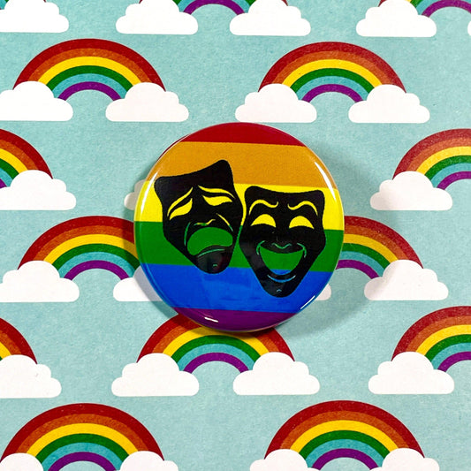 rainbow button with theatre masks on colorful background